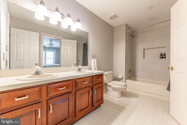 full bathroom with toilet, vanity, shower / bath combo, ceiling fan, and tile patterned flooring