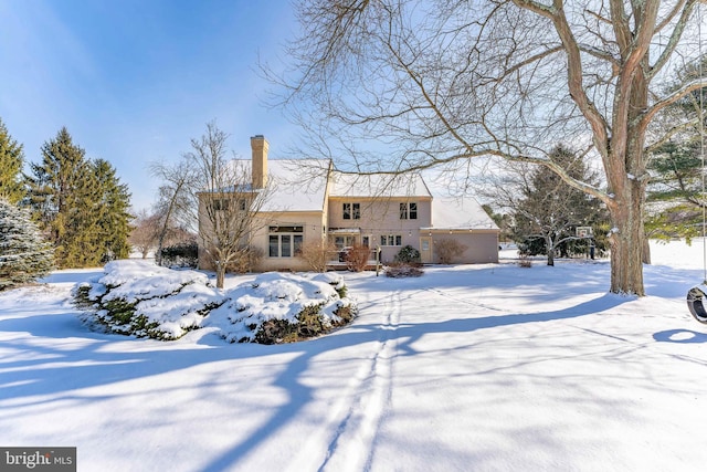 view of snow covered property