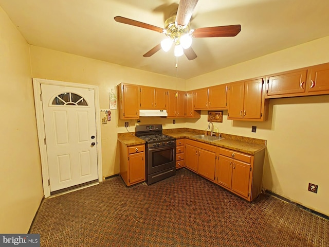 kitchen with ceiling fan, sink, dark carpet, and stainless steel gas stove