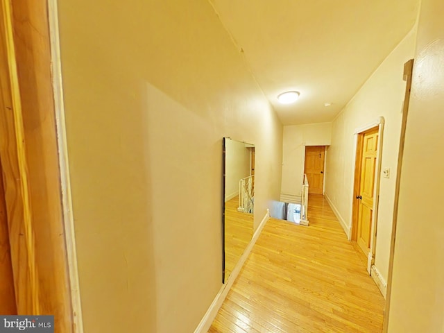 hall with light hardwood / wood-style flooring