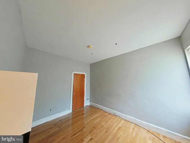 empty room featuring hardwood / wood-style floors