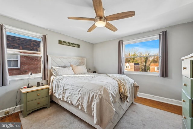 bedroom with ceiling fan and light wood-type flooring