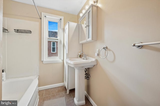 bathroom featuring tile patterned flooring and  shower combination