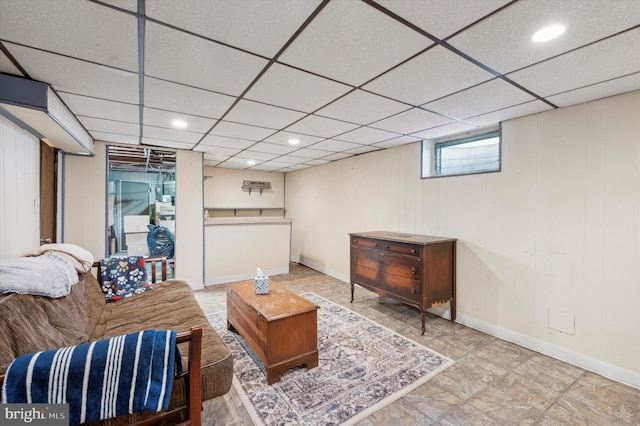 living room with a drop ceiling