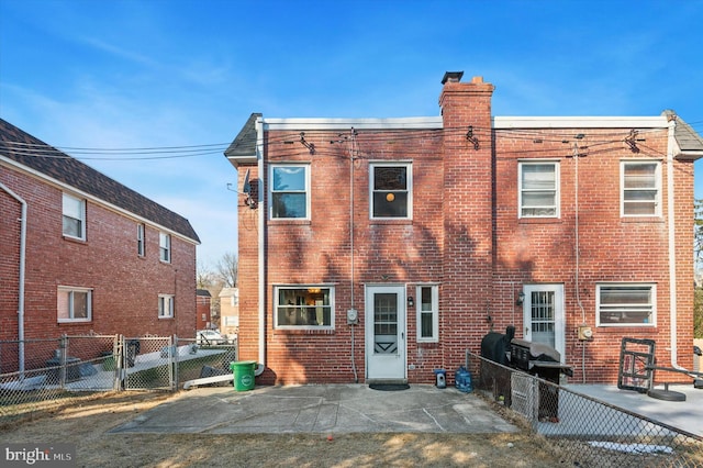 rear view of house featuring a patio