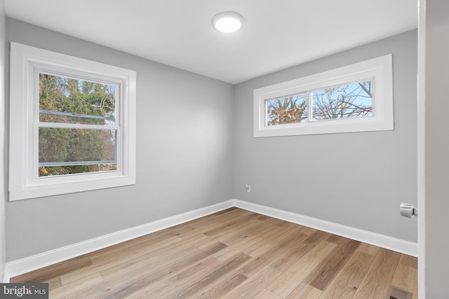 spare room featuring light hardwood / wood-style flooring