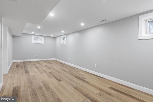 basement featuring light hardwood / wood-style floors