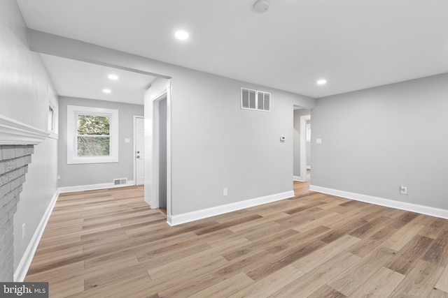 interior space featuring a fireplace and light hardwood / wood-style floors