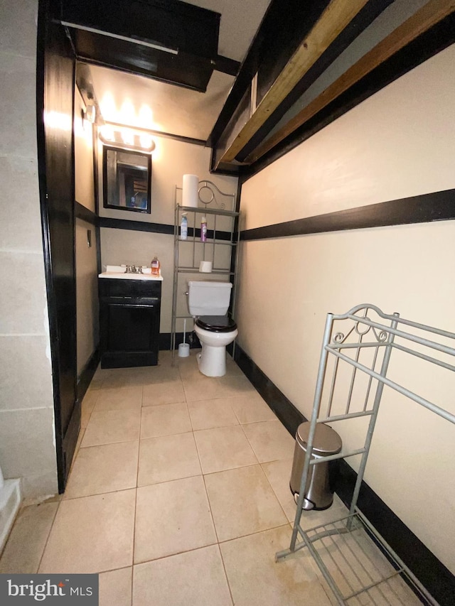 bathroom with tile patterned flooring and toilet