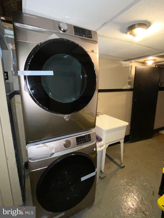 washroom with stacked washer and dryer