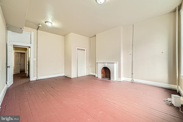 unfurnished living room with hardwood / wood-style flooring