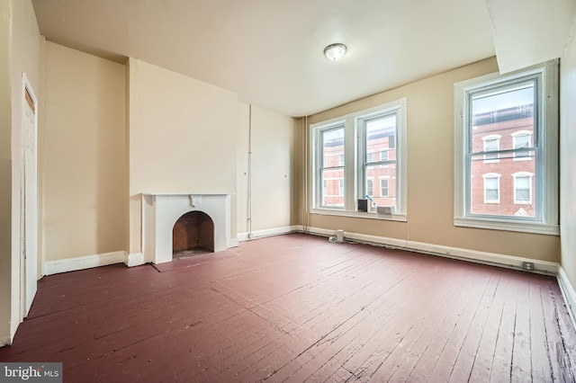 unfurnished living room featuring dark wood-type flooring