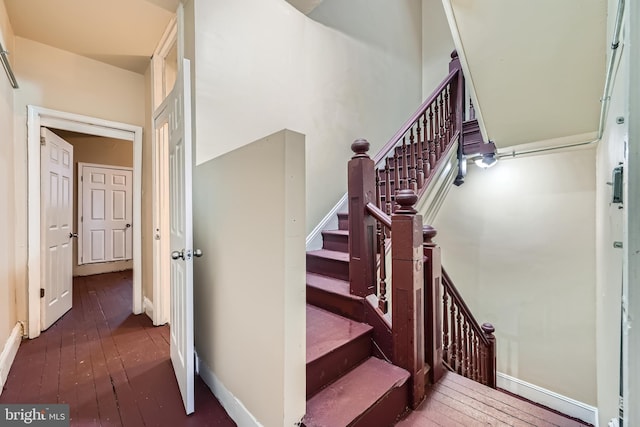 stairs with wood-type flooring