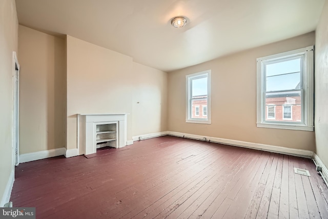 additional living space featuring dark hardwood / wood-style floors