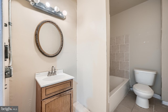 bathroom featuring tile patterned flooring, vanity, and toilet