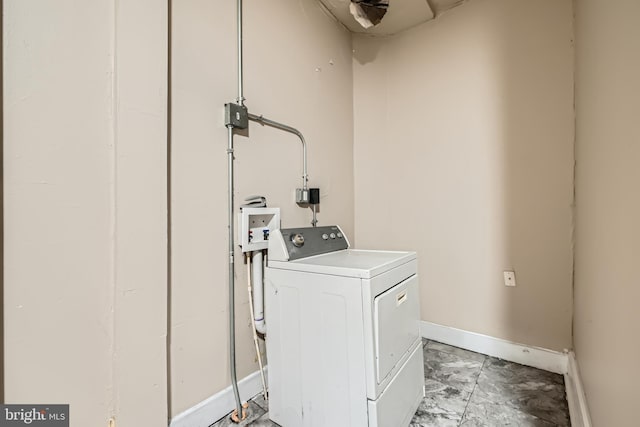 clothes washing area featuring washer / dryer