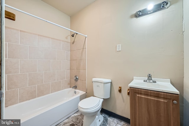 full bathroom with vanity, toilet, and tiled shower / bath combo