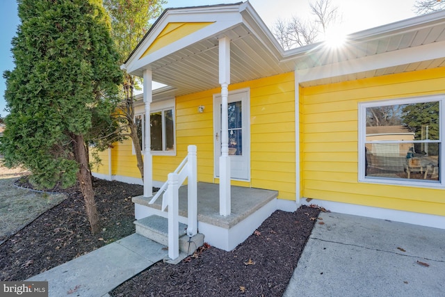 doorway to property featuring covered porch