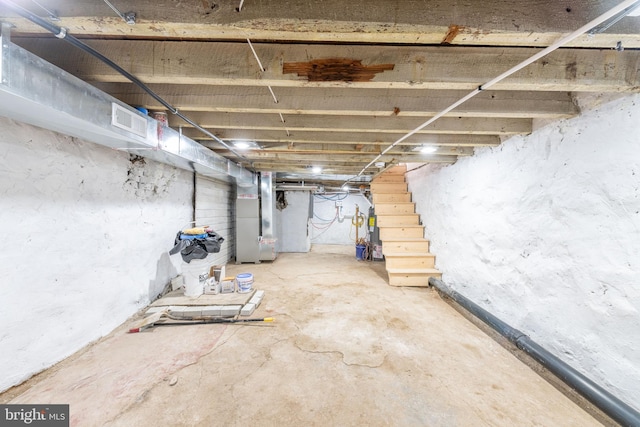 basement featuring heating unit