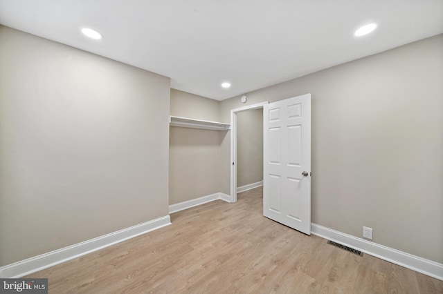 basement featuring light hardwood / wood-style flooring