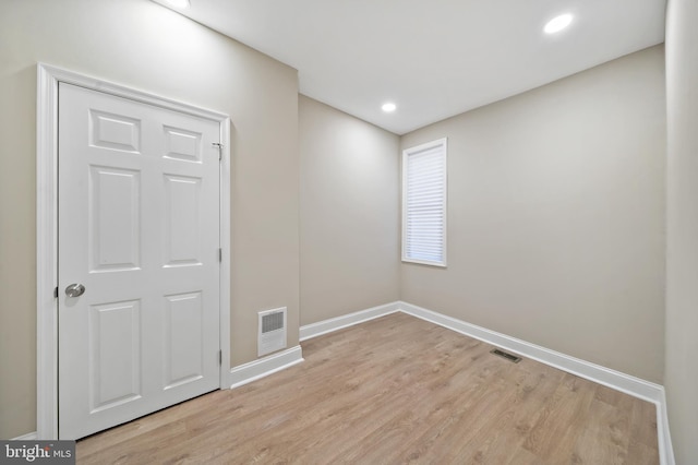 unfurnished room featuring light hardwood / wood-style flooring