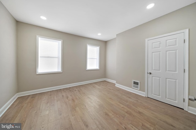 unfurnished room featuring light wood-type flooring