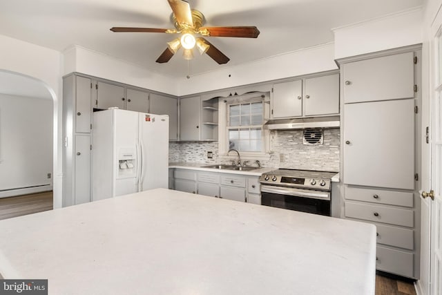 kitchen featuring stainless steel range with electric cooktop, dark wood-type flooring, sink, decorative backsplash, and white fridge with ice dispenser