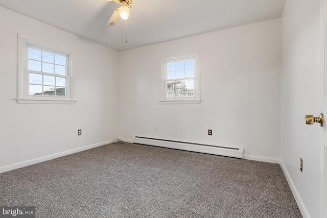 carpeted empty room featuring a healthy amount of sunlight, ceiling fan, and a baseboard radiator