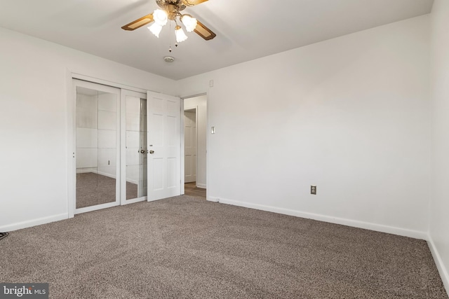 unfurnished bedroom featuring carpet flooring, ceiling fan, and a closet