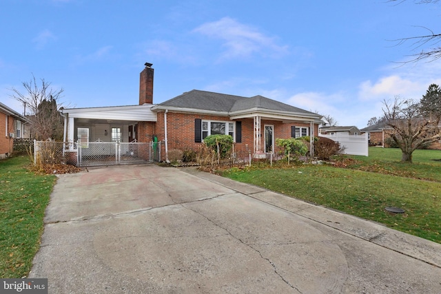 ranch-style house featuring a carport and a front lawn