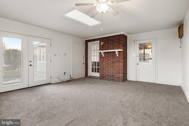 unfurnished living room featuring carpet, ceiling fan, and french doors