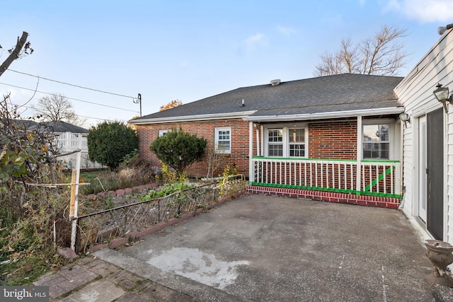 back of property with a patio area