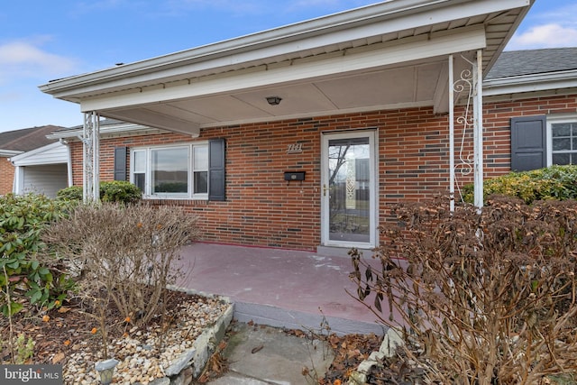 property entrance featuring a patio area