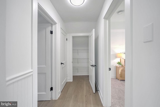 hall with light hardwood / wood-style floors