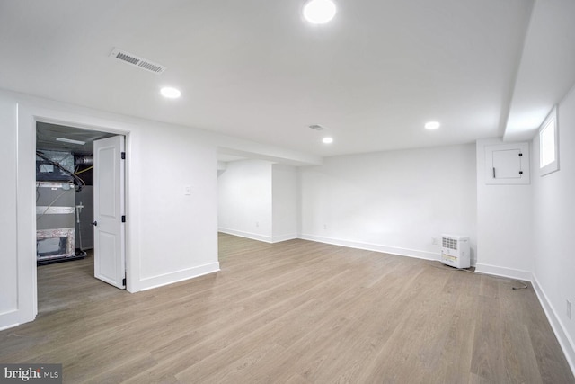 basement featuring light hardwood / wood-style floors