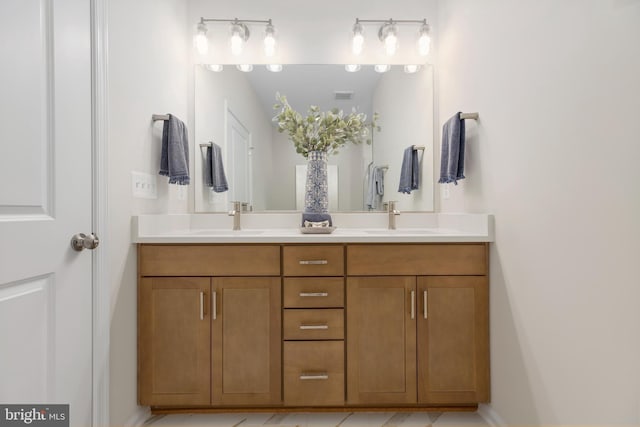 bathroom featuring tile patterned flooring and vanity