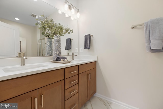 bathroom featuring vanity and a shower with shower door