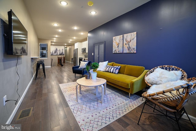 living room featuring dark wood-type flooring