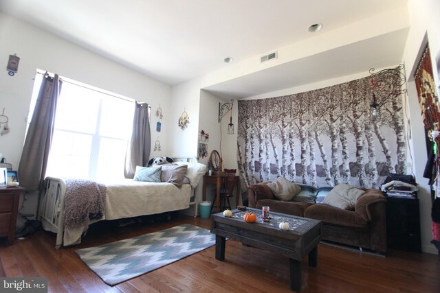 bedroom featuring dark hardwood / wood-style flooring