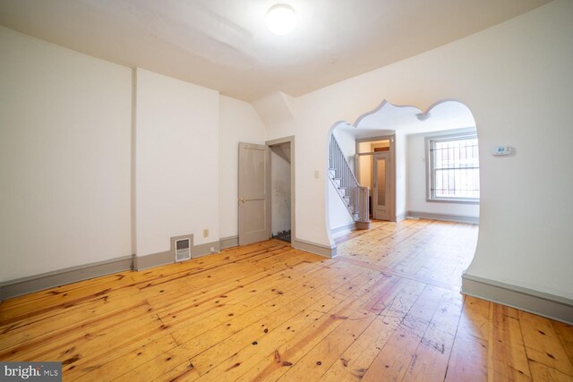 spare room with light hardwood / wood-style flooring