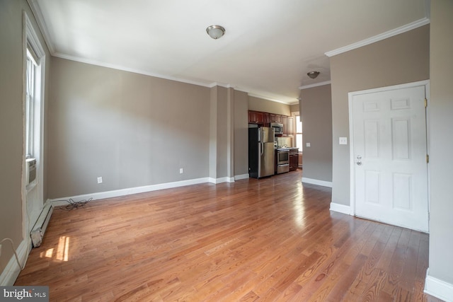 unfurnished living room featuring baseboard heating, light hardwood / wood-style floors, and ornamental molding