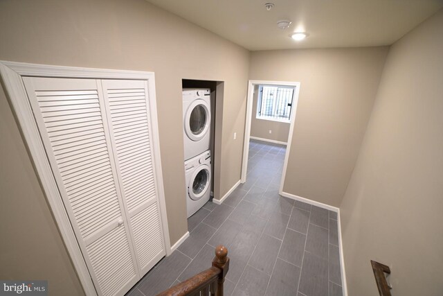 laundry room featuring stacked washer and clothes dryer