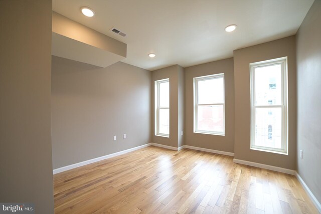 unfurnished room featuring light hardwood / wood-style floors