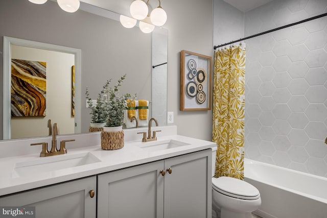 full bathroom featuring shower / bath combination with curtain, vanity, and toilet