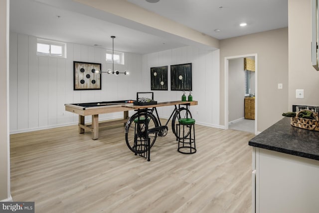 game room featuring wooden walls, billiards, and light hardwood / wood-style flooring