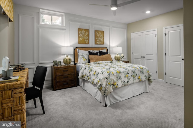 carpeted bedroom featuring ceiling fan