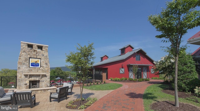 exterior space with an outdoor stone fireplace