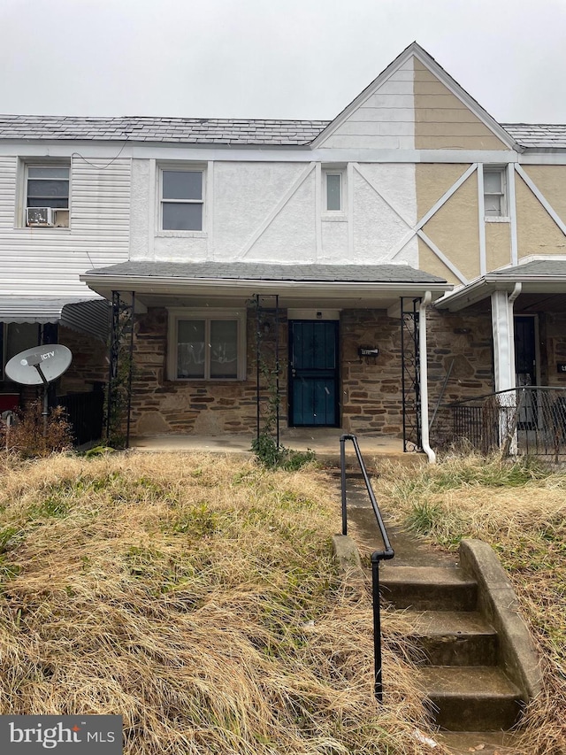 view of front of home with a patio and stucco siding