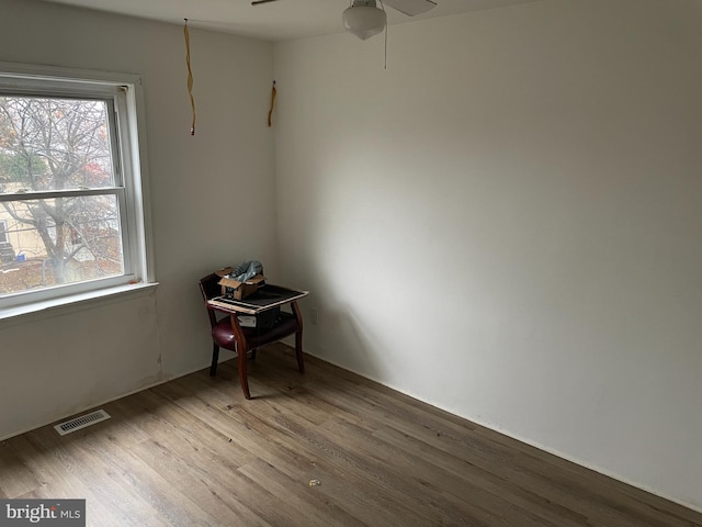 spare room with ceiling fan and light hardwood / wood-style floors