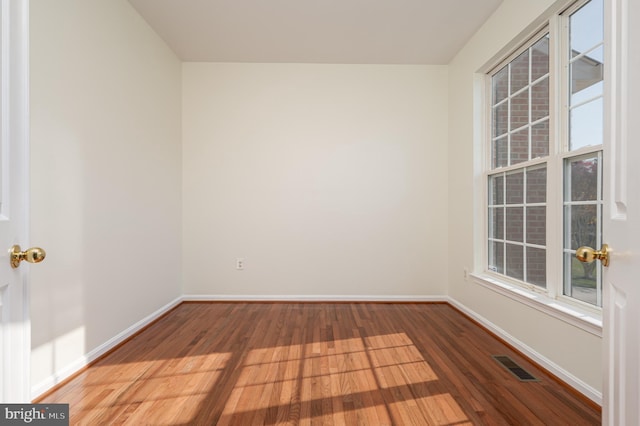 empty room featuring hardwood / wood-style floors